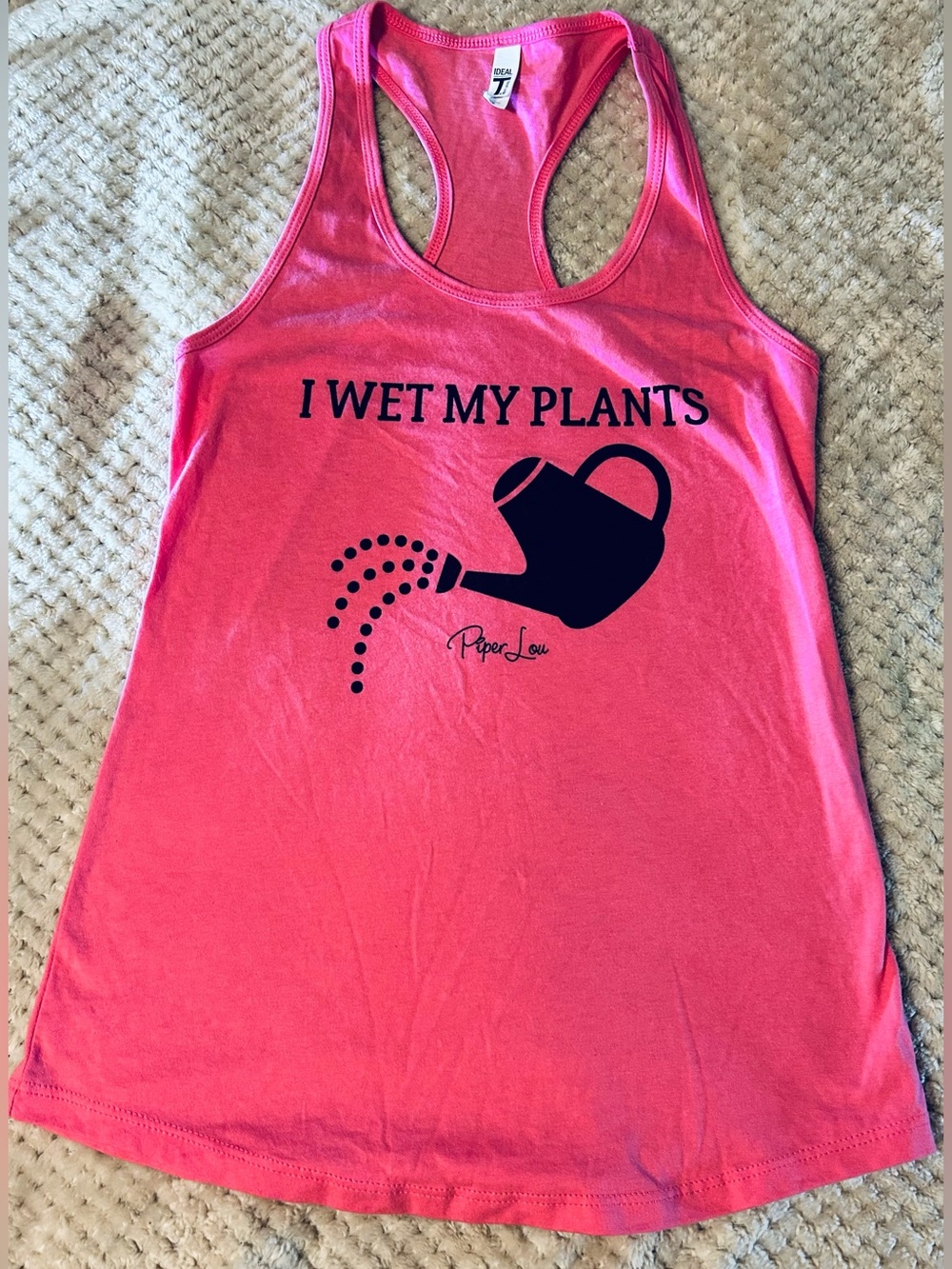 Piper Lou Tank Top That Features a Playhul "I Wet My Plants" Logo In Black.